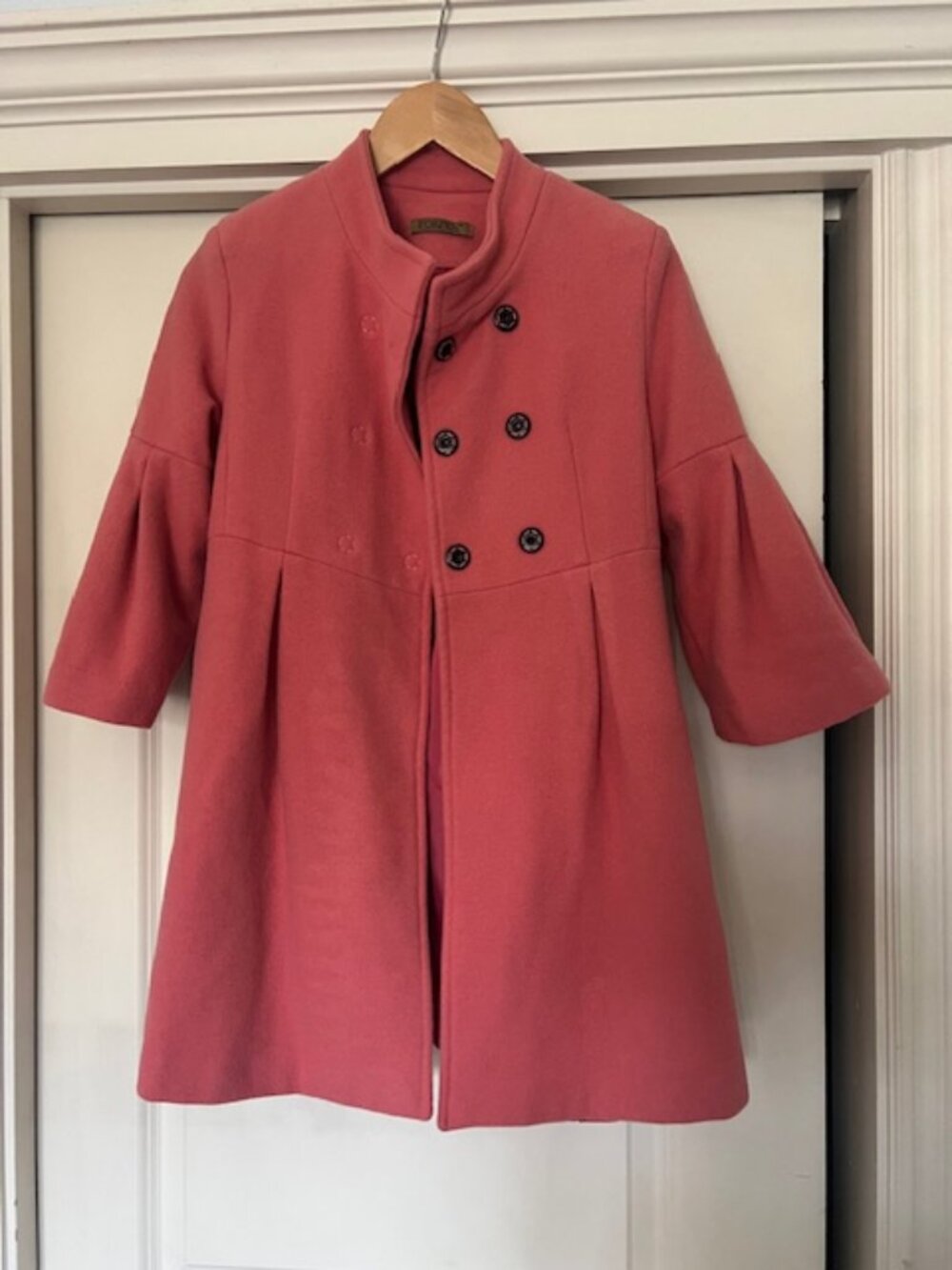 Tangerine colored coat